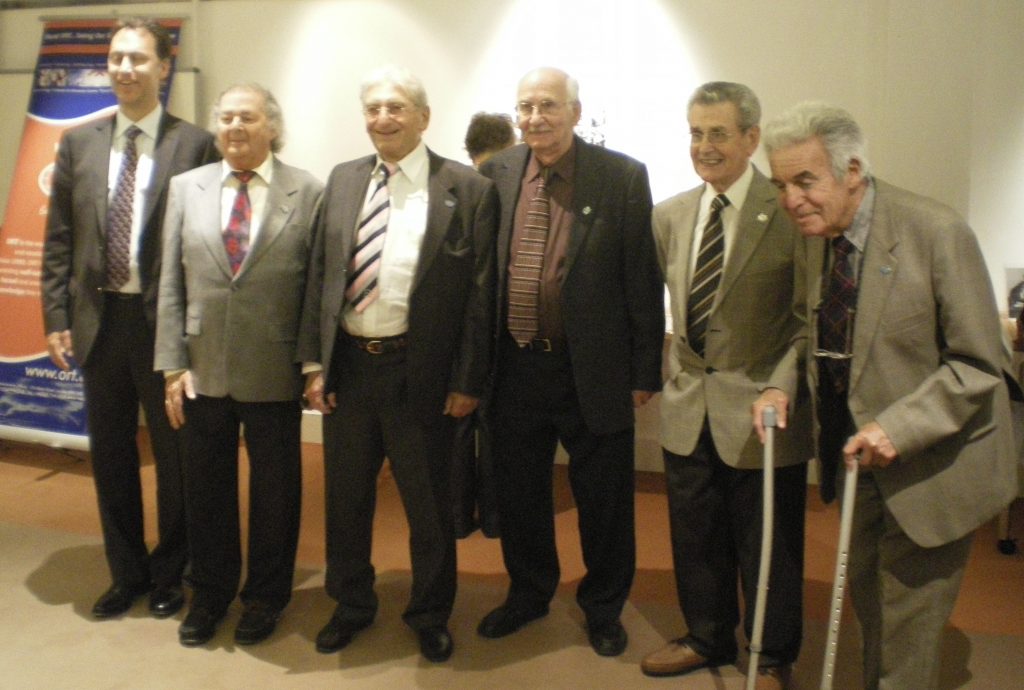 Kitchener camp, ORT boys, 21 September 2011, ORT headquarters, Camden Town. Unveiling a plaque to commemorate Colonel H. Levey. From left to right: Simon Alberga, British ORT chairman, Bert Goldsmith, Hans Futter, Ernest Lowenberg, Graham Curzon, Felix Bujakowsky. Photo by Monica Lowenberg – rights reserved.